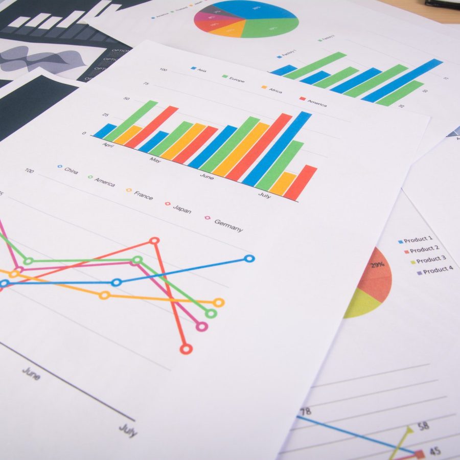 Business report. Graphs and charts. Business reports and pile of documents. Business concept. Business report. Graphs and charts. Business reports and pile of documents. Business concept.