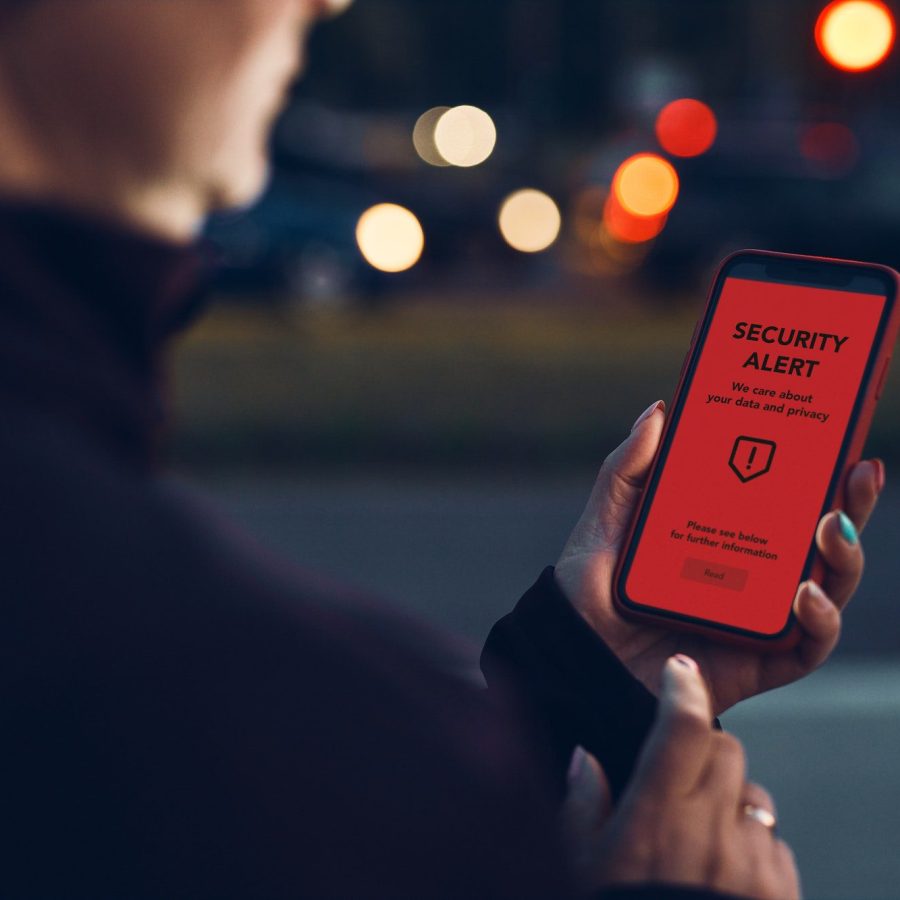 Security alert on smartphone screen. Antivirus warning. Private data protection system notification Security alert on smartphone screen. Antivirus warning. Private data protection system notification