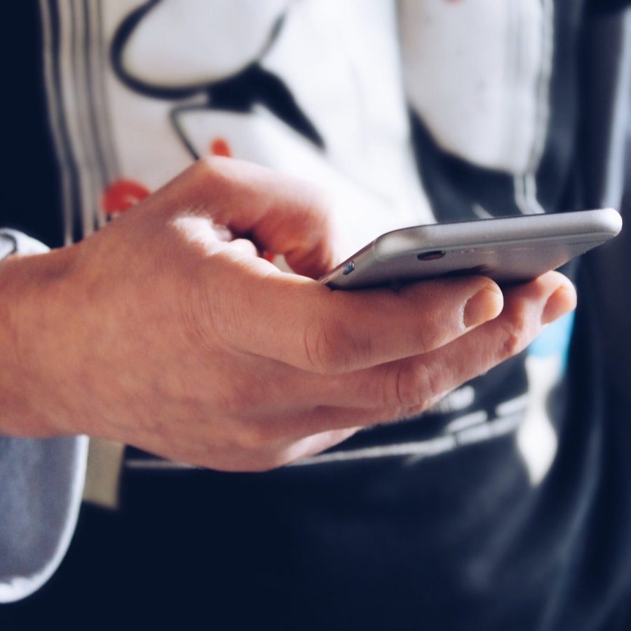 The young man texting message The young man texting message